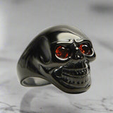 unisex black skull ring red gem eyes bold biker ring perfect gift for him or her durable high quality black plated fast free shipping stainless steel red cz eyed black skull ring top notch stainless steel enduring fiery red cubic zirconia eyes posh dark finish daring edgy vibe polished sterling silver silky smooth comfy to wear unique biker jewelry alternative fashion statement gothic punk rocker ring mens womens