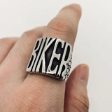 flip off middle finger ring stainless steel statement piece bold and enduring rebellious spirit rugged durability edgy style bikers motorcycle riders rock punk goth fashion big chunky ring eye-catching design substantial jewelry provocative touch unisex appeal versatile jewelry collection withstands test of time resilient and striking individuality strength leather jacket rock band t-shirt goth-inspired attire unique style concert open road everyday statement accessory handcrafted